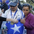 Angelica Alvarez embraces her husband Edison Pena as he finishes the New York Marathon last Sunday - Pena was one of the 33 miners who were rescued from a Chilean mine after 10 days