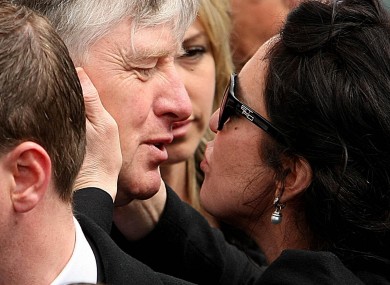 Pat Kenny kisses Morah Ryan, separated wife of broadcaster Gerry, at the star's funeral in May of this year.
