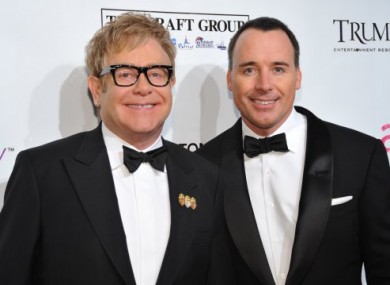 In this 18 October, 2010 photo, Sir Elton John and David Furnish attend the Ninth Annual Elton John AIDS Foundation benefit.