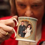 Margaret Tyler drinking a cup of tea in a William and Kate mug as she celebrates the engagement of Prince William and Kate Middleton in the Princess Diana room of her home in Wembley, north London.