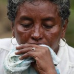 Ana Luz Acosta, a relative of miner Jorge Lara, sheds tears outside La Preciosa coal mine in Sardinata, Colombia. Lara is among 20 miners feared dead after an explosion there on Wednesday.