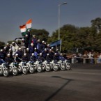 Indian Army daredevils perform stunts on a bike during rehearsals for the upcoming Republic Day, in New Delhi, India on Tuesday.