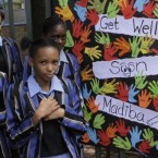 Students from a school near the hospital where former South African President Nelson Mandela, fondly known as 'Madiba', was undergoing medical tests this week. He was released from hospital today.