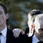 The most important men in Michaela McAreavey's life, her husband John and father Mickey Harte, are locked in their own world of grief at her funeral in Co Tyrone on Monday.