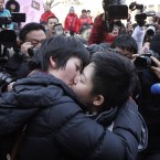 A Chinese lesbian couple kisses in front of journalists. Beijing's gay and lesbian community celebrated Valentine's Day by calling for greater gay rights in China on Monday in Beijing. (AP Photo/Andy Wong)