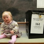 One-year-old Rose Verveen quite sensibly doesn't have her head turned by the action around her at a polling station in Glenealy, Co Wicklow today. Pic: Julien Behal/PA Wire
