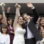 Emma Howard shows her joy at her wedding to Chris Greenslade just days after she was pulled from the rubble of the earthquake in Christchurch, New Zealand. Pic: AP Photo/Mark Baker