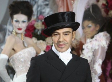 File photo of John Galliano with a Dior collection in 2010.
