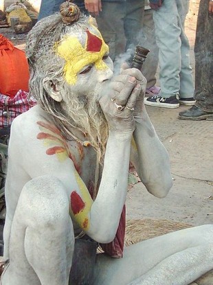 A sadhu smokes a chillum at the Pashupatinath Temple during Shivaratri