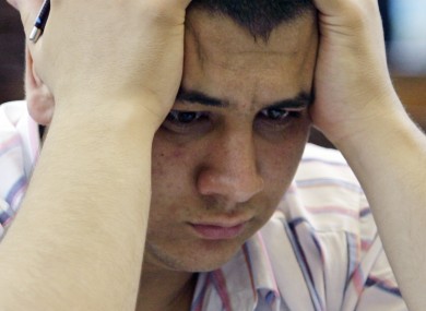 A Turkish student holds his head during the nation's university entrance exam.