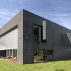 ...a huge metal shutter descends and heavy concrete panels swing over the windows...<span class=