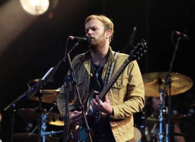 Caleb Followill from the Kings of Leon plays at Slane.