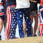 Spectators with colourful trousers follow USA's John Daly at the 2011 Open Championship at Royal St George's, Sandwich.