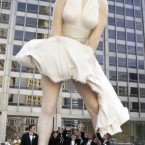 Seward Johnson's 26-foot-tall sculpture of Marilyn Monroe, in her most famous wind-blown pose, stands on Michigan Avenue in Chicago. (AP Photo/Charles Rex Arbogast)