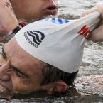 Greece's Spyros Gianniotis pulls off his cap after winning th men's 10km Open Water swimming event at the FINA Swimming World Championships at Jinshan Beach in Shanghai, China on 20 July. Gianniotis finished with a time of 1:54.24.7. (AP Photo/Ng Han Guan)