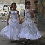 Palestinian girls in wedding dresses at Shati Refugee Camp in Gaza City (AP Photo /Adel Hana)