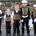 Young band members wait to join a Twelfth of July march by Orangemen in Belfast (Paul Faith/PA Wire)