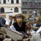 An aged displaced person lives in his makeshift home in Karachi, Pakistan (AP Photo/Shakil Adil)