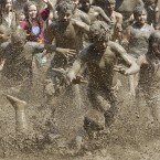 Children during the annual Mud Day in Westland, Michigan (AP Photo/Carlos Osorio)