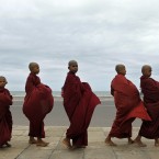 A group of young Buddhist monks parade seeking alms in Colombo, Sri Lanka (AP Photo/ Eranga Jayawardena)