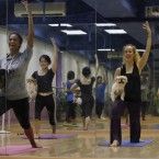 Students practice Dog Yoga, or 'Doga', with their pets during a lesson in Hong Kong (AP Photo/Kin Cheung)