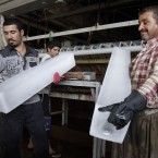 Workers at an ice factory in Baghdad, Iraq  (AP Photo/Karim Kadim)