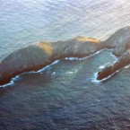 An aerial view shows the Necker Islands, one of the remote 1,400-mile long string of the Northwestern Hawaiian Islands. One island owned by the Virgin group boasts villas and a Great House 