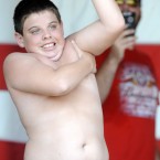 Daniel Wright competes in the armpit serenade during the 15th annual Redneck Games. Mike Stewart/AP/Press Association Images