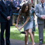 Kate puts her back into the tree-planting ceremony.
