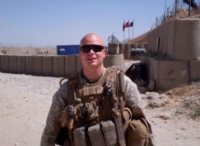 Sgt. Scott Moore will have Mila Kunis on his arm for the Marine Corps Ball in November