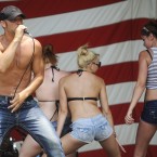 Jeff Vaughn sings at the games. (AP Photo/Mike Stewart)