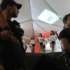 Prison guards watch as the prison beauty contest gets under way. (AP Photo/Eraldo Peres)