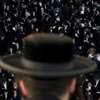Ultra-Orthodox Jews attend a prayer in the religious neighborhood of Mea Shearim, Jerusalem (AP Photo/Bernat Armangue)