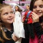 Daisy, 5, and Millie Robinson, 9, from Suffolk with the figurines (Lewis Whyld/PA Wire)