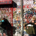 Italian backpackers add their messages to the wall of graffiti dedicated to U2 at Windmill Lane [File photo: Photocall Ireland] 