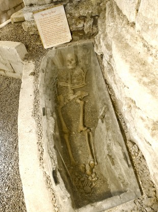 The tomb containing a skeleton visible through a glass panel in the five-bedroomed house in Sweden.