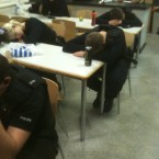 Police officers sleep at their desks between duties during the UK riots (PCStanleyWMP on Twitpic)