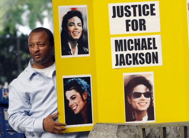 An activist demonstrating outside the LA court earlier this month