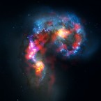 The Antennae Galaxies about 70 million light years away in the Corvus constellation. Image combines ALMA observations and visible light observations from Hubble. (Image: ALMA (ESO/NAOJ/NRAO). Visible light image: the NASA/ESA Hubble Space Telescope)