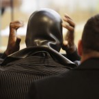 Fodor dons his Phoenix Jones mask at a Seattle court yesterday. (AP Photo/Ted S. Warren/PA Images)