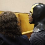 Ben Fodor and one of his attorneys, Caitlin DiMotta, await the court hearing in Seattle yesterday. (AP Photo/Ted S. Warren/PA Images)