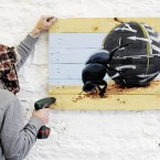 A stencil called Lampooning the Naas Ball is fixed into position. (Image: Niall Carson/PA Wire)