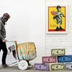 A cement mixer is put into position at the Pricks and Mortar exhibition by street artist ADW. (Image: Niall Carson/PA Wire)