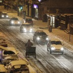 Motorists make their way home in the snow in the early hours of the morning in the Rathmines area of Dublin.