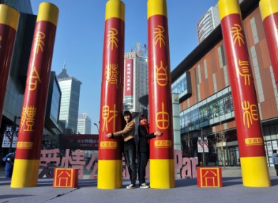 Six pillars mark Singles Day on a shopping street in Shenyang City in the northeast Chinas Lianoning province. 