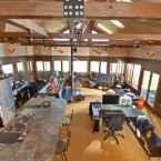 The above-ground area of the house - with all-mod-cons kitchen, work space, and flat screen TV