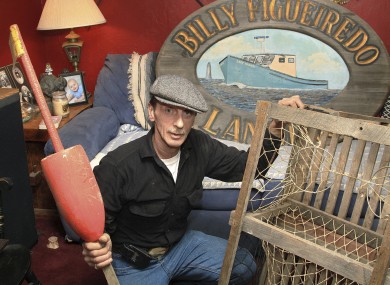 Richard Figueiredo poses with a lobster trap having lost hundreds in what came to be known as 