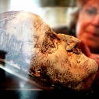 Jean Durkan from Tullamore looks at the death mask of celebrated Irish author James Joyce at the Little Museum of Dublin on St Stephen's Green, Dublin. (Julien Behal/PA Wire)