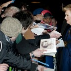 Meryl Streep signs autographs for fans.