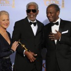 Actor Morgan Freeman poses backstage with the Cecil B. Demille Award with Helen Mirren and Sidney Poitier. (AP Photo/Mark J Terrill/PA Images)